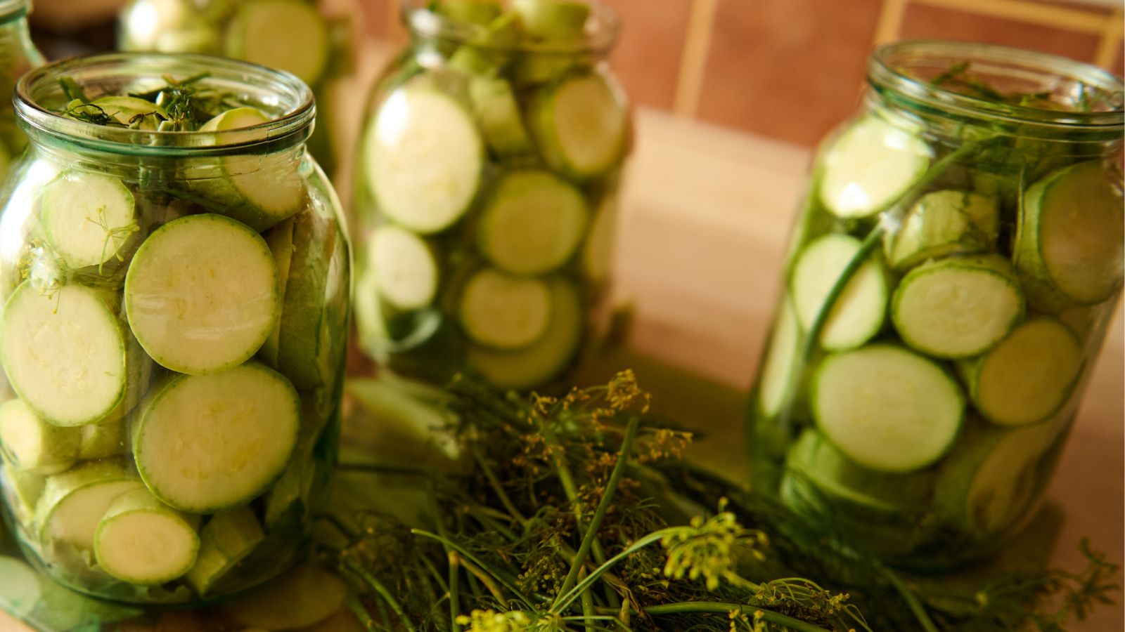 jars filled with zucchini slices for pickling.