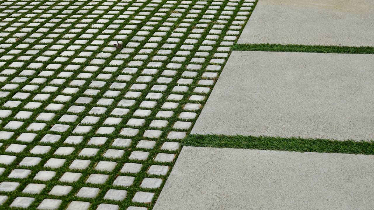 driveway design with ornamental grass and concrete pavers