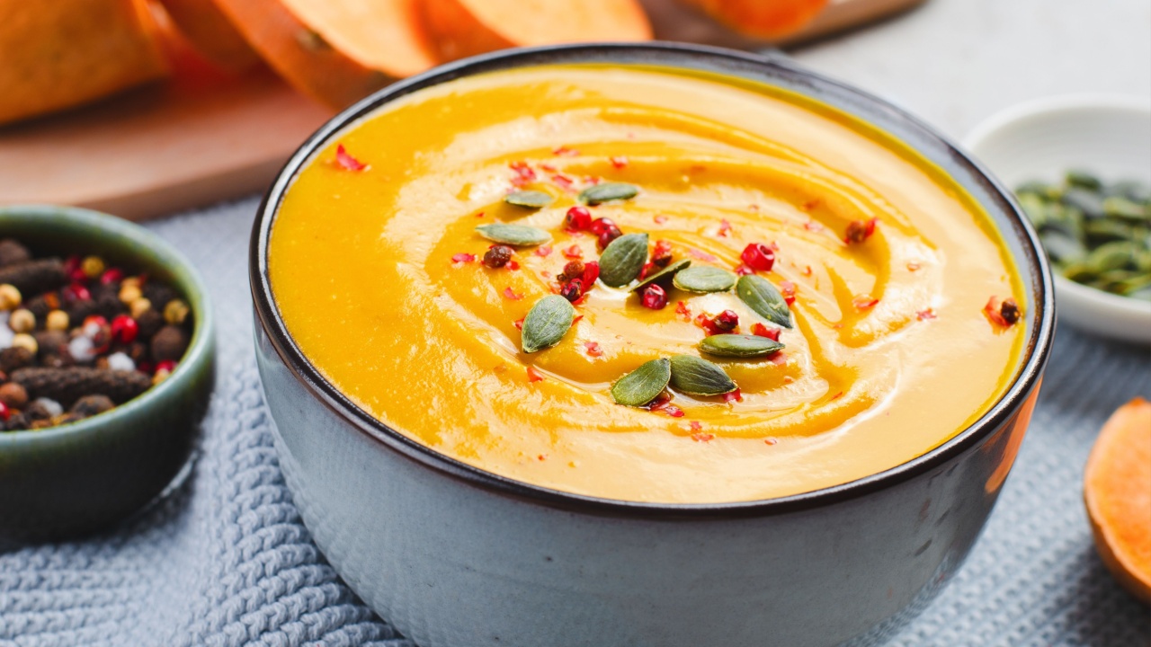 Sweet Potato Soup, Tasty Homemade Pumpkin, Sweet Potato, Carrot Soup in a Bowl on Bright Background