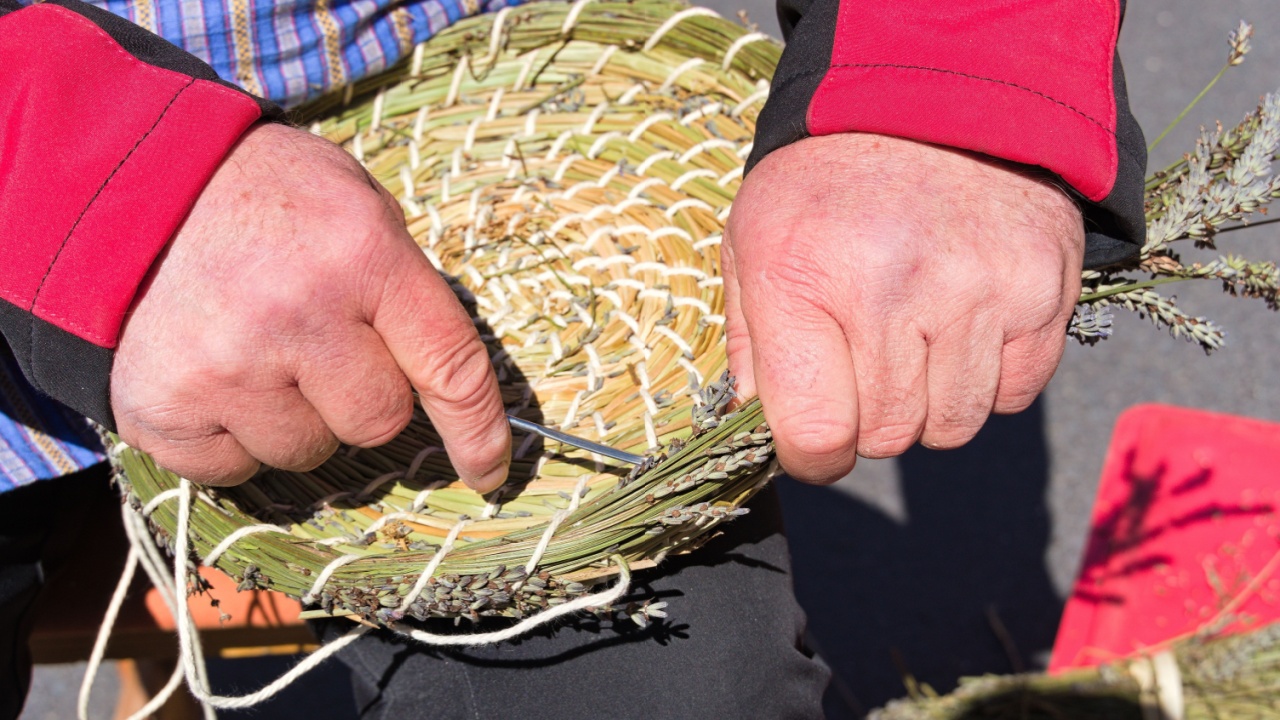 old craft basket weaving - craftsman weaving a round basket