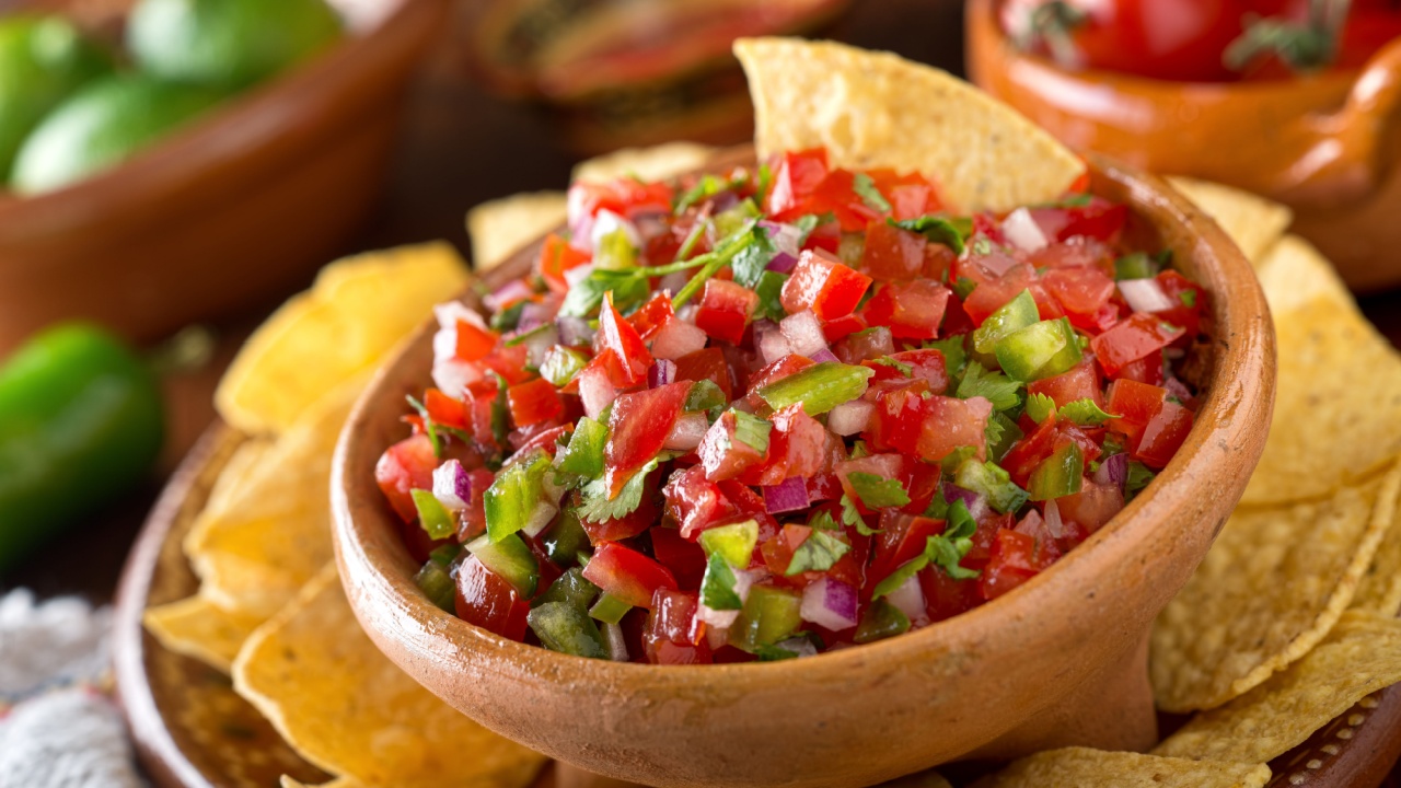 A delicious home made salsa pico de gallo with tomato, red onion, lime, cilantro, and jalapeno pepper.