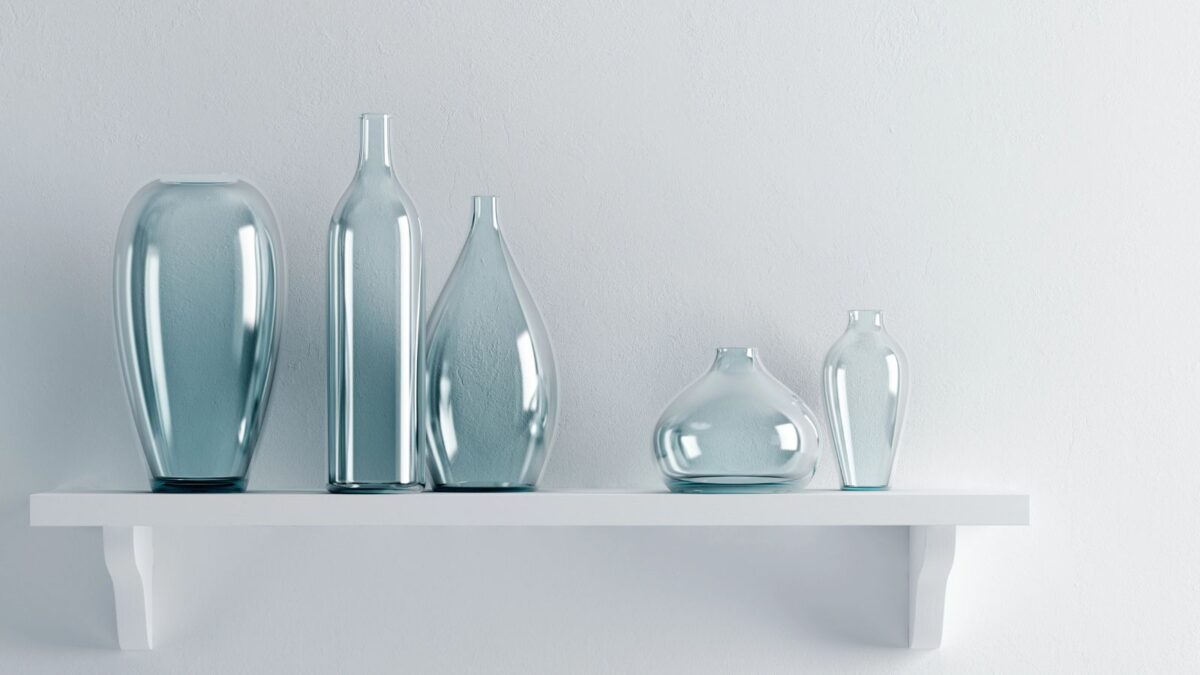 blue vases displayed on a white shelf.