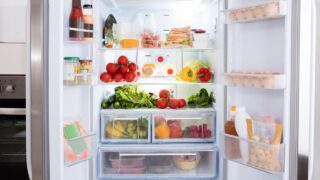 Open Refrigerator Filled With Fresh Fruits And Vegetable