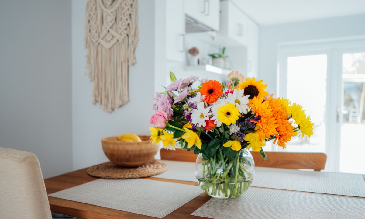 flowers in vase on dining room table