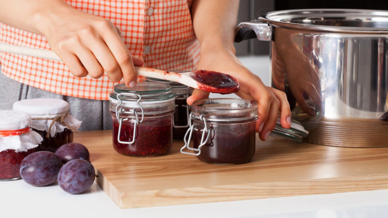 Homemade fruits preservation. Making fruit jams based on traditional recipe
