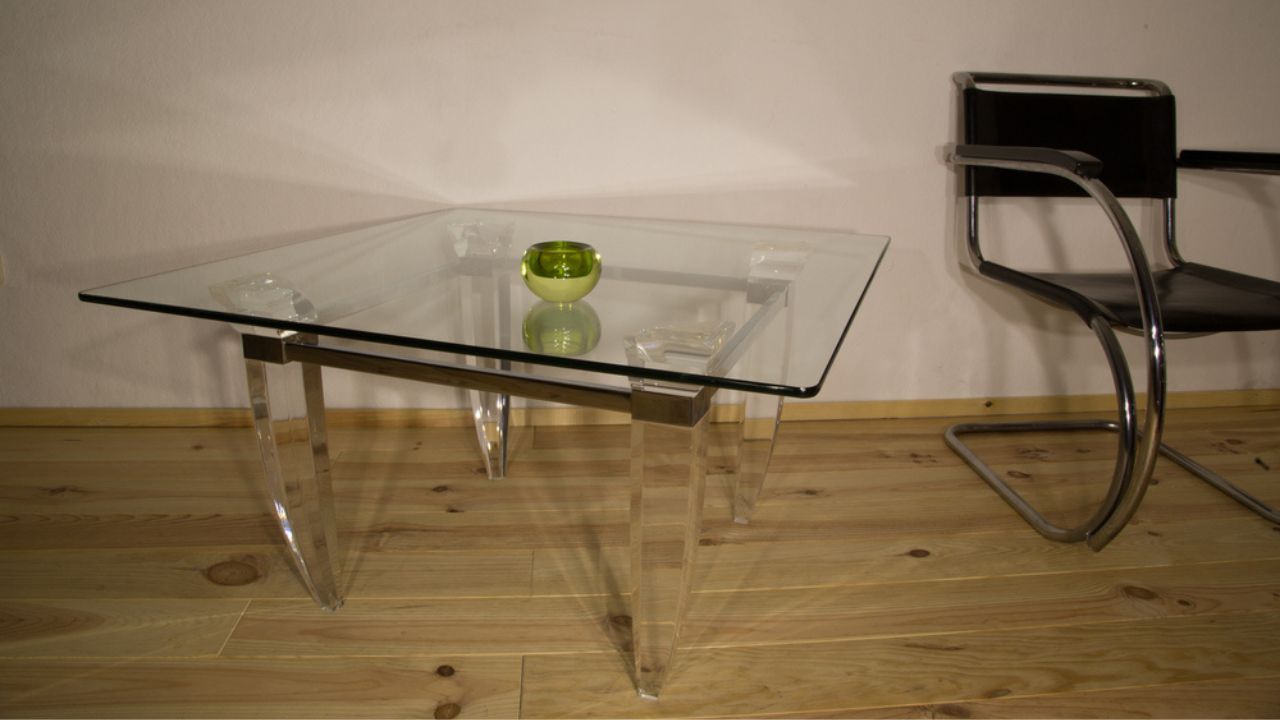 Vintage design coffee table top made of crystal glass frame made of chrome-plated steel and acrylic glass