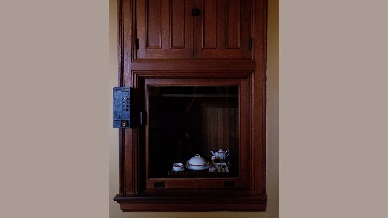 A dumbwaiter in the china pantry, with a tray of tableware placed inside, leads to the upper stories of Biltmore House, on Biltmore Estate in Asheville, North Carolina
