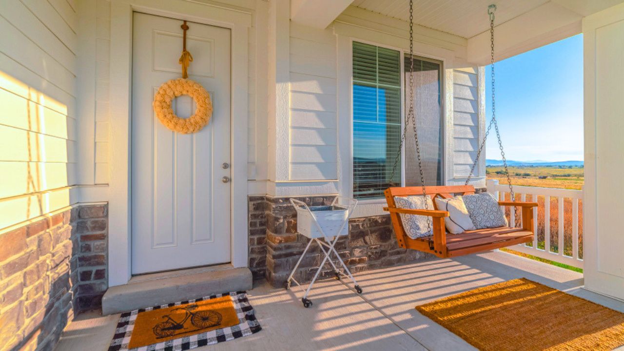 Panorama frame Front porch of modern home with swinging chair