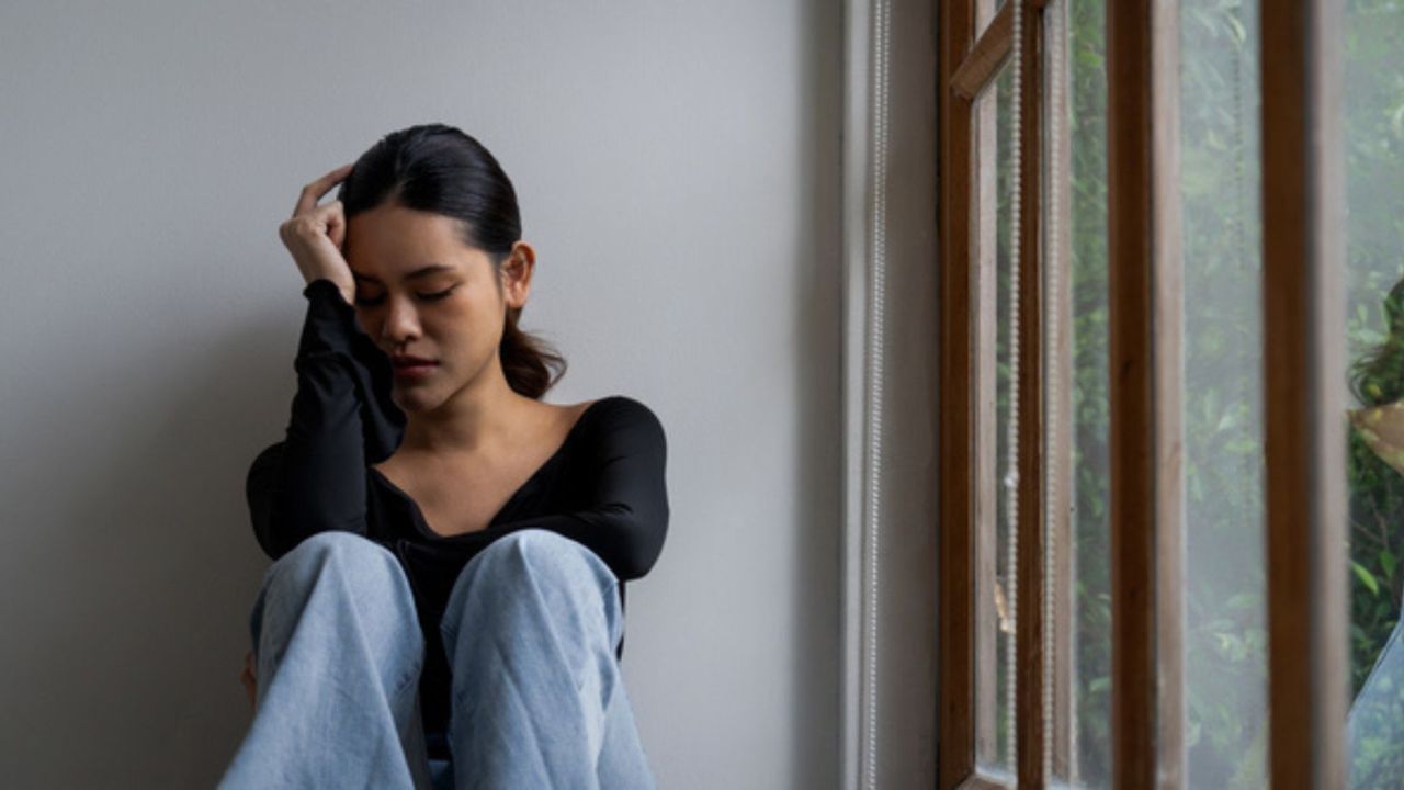 Sad Young Girl Sits on Ground Next to Window Sad Depressed