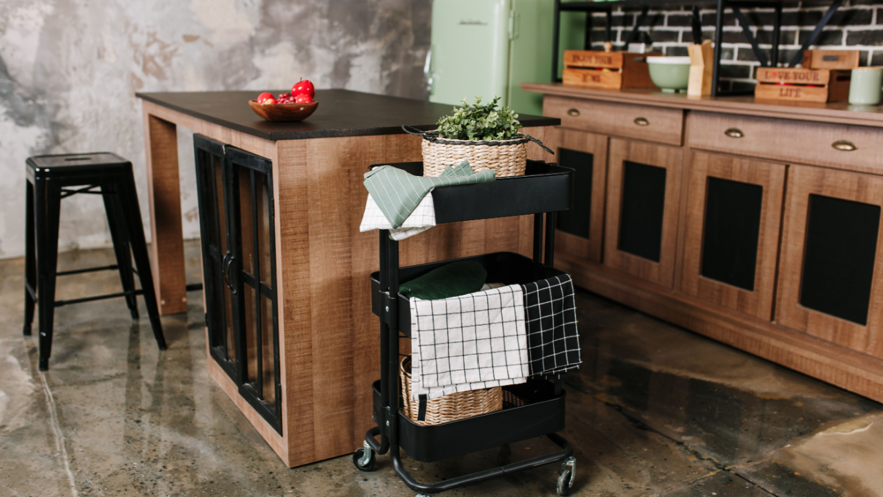 industrial kitchen with rolling cart island green fridge