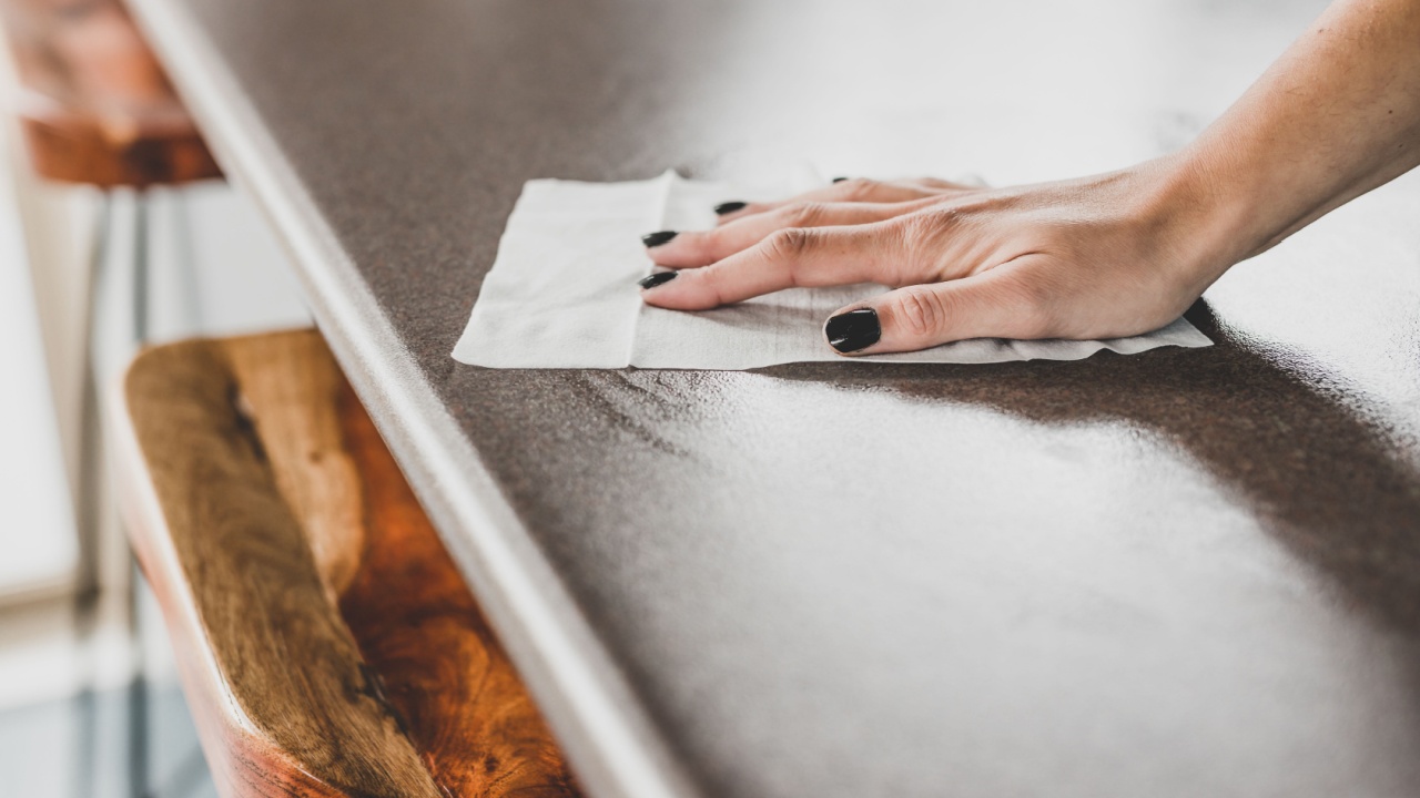 concept of disinfecting surfaces from bacteria or viruses, hand cleaning bar table with disinfectant wet wipe