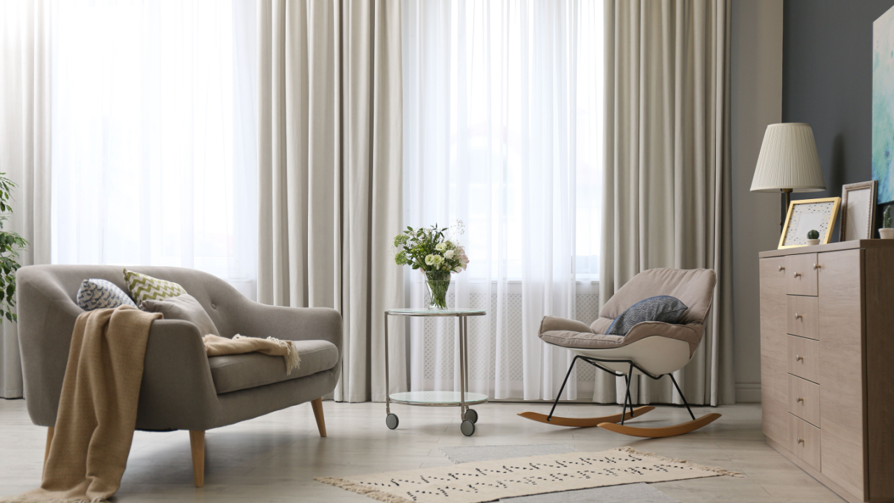 cozy modern living room with gray curtains lamp and rocking chair