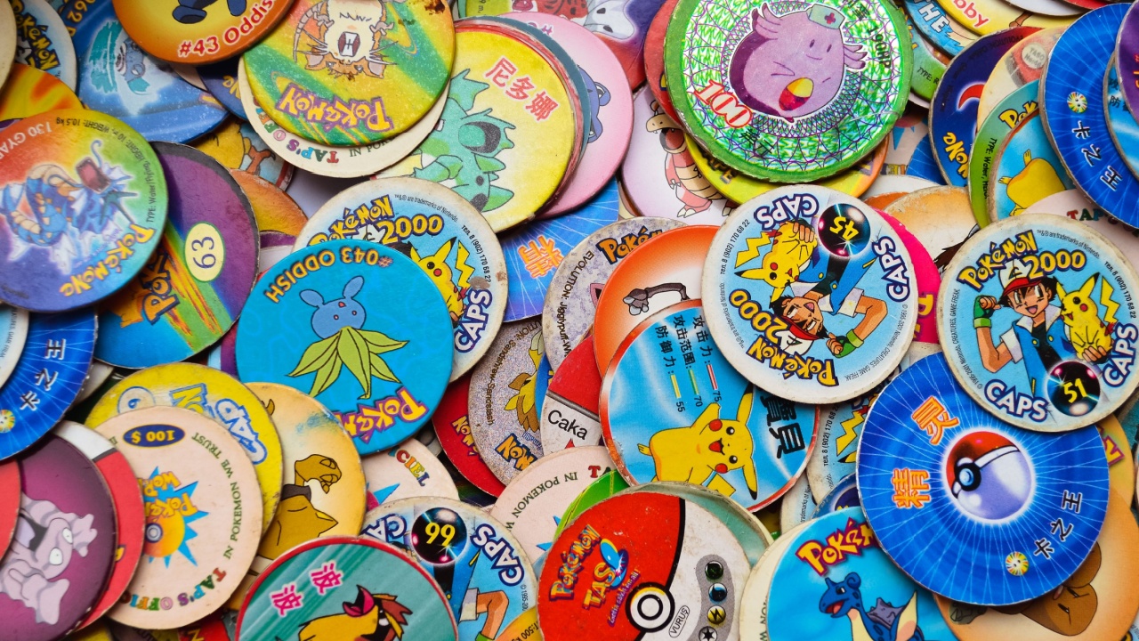 Kopeysk, Russia - August 11, 2021. The city of Kopeysk. A big pile of old playing childrens Pokemon chips