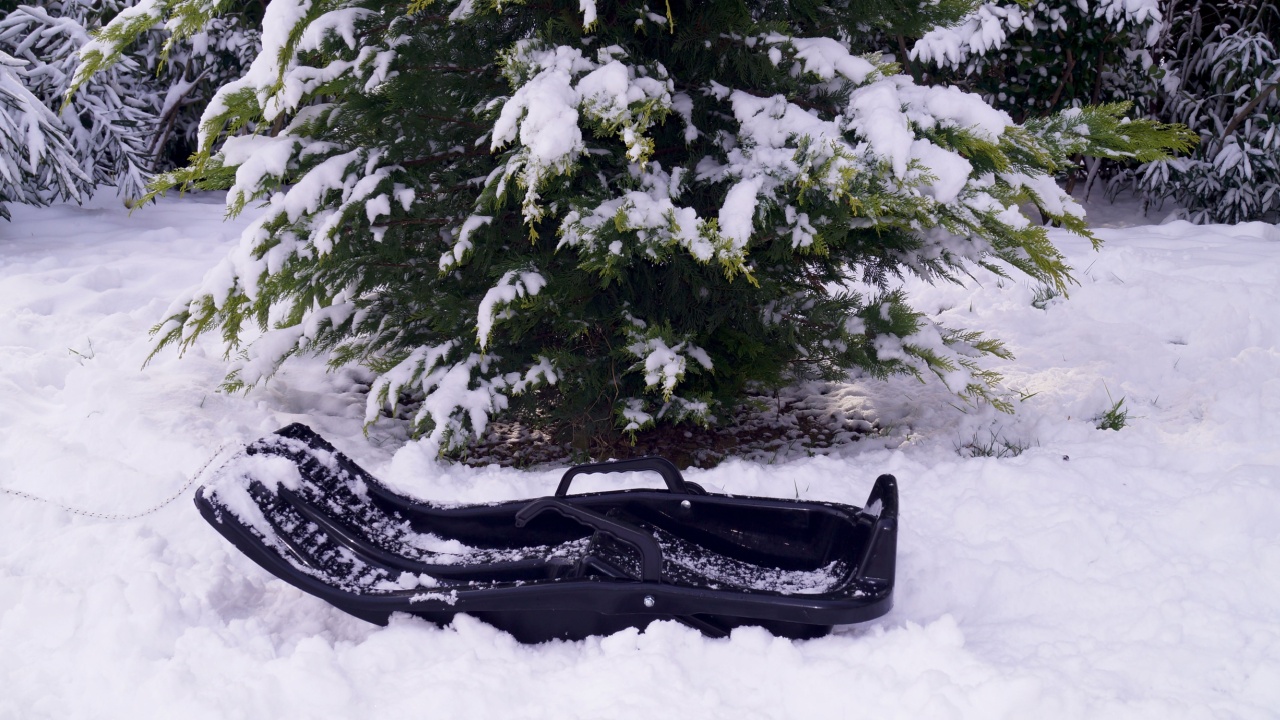 plastic sled on the snow. High quality photo