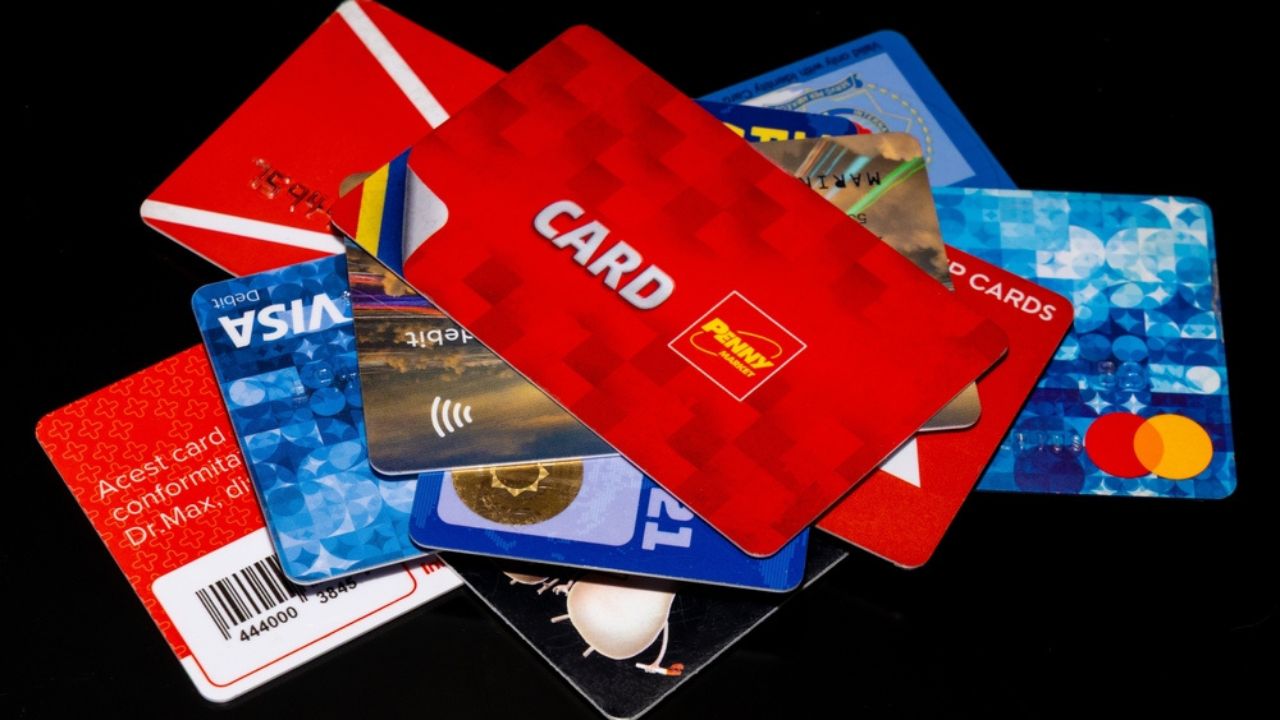 Various loyalty and banking cards on a black background in Sovata city-Romania. They are used as a payment method or as customer loyalty 26.Feb.2025
