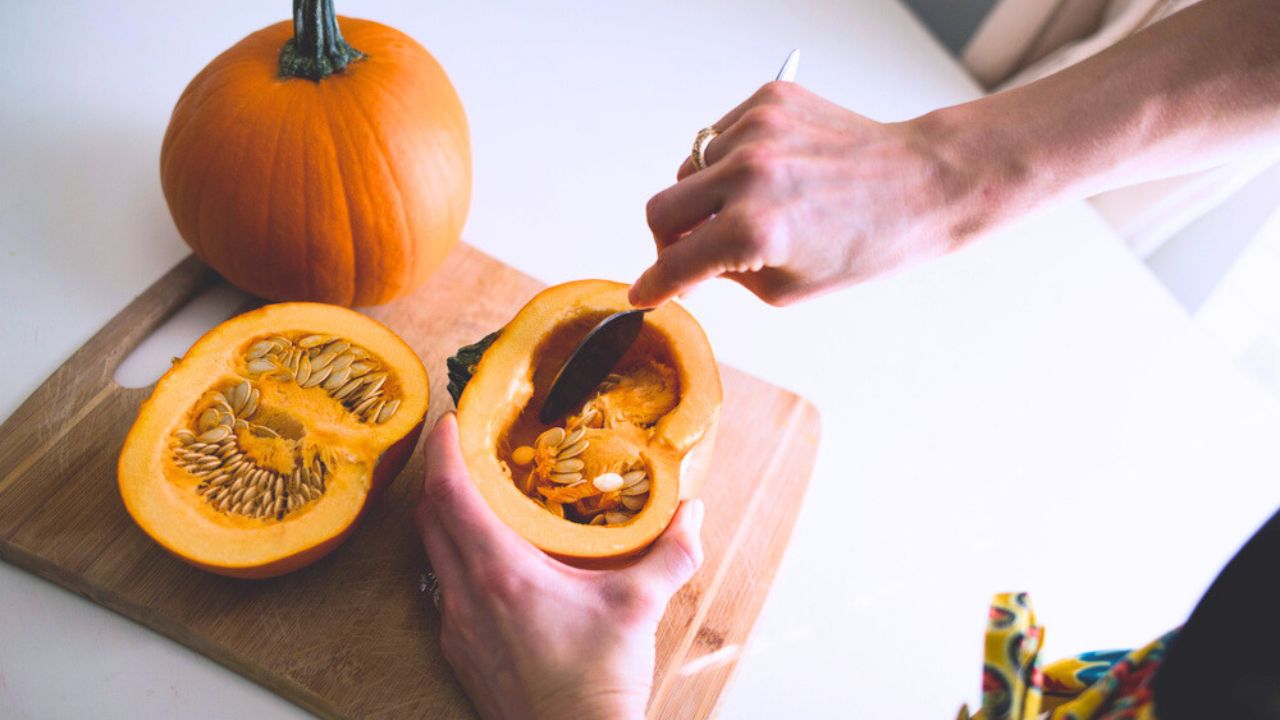 Woman Scooping out Pumpkin seed