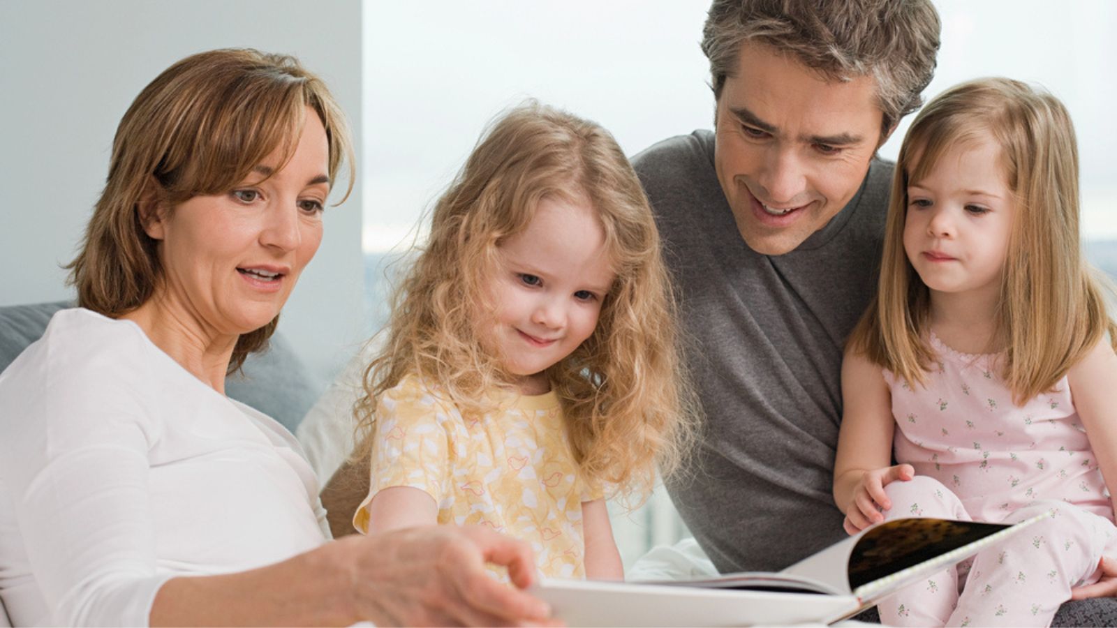 Family reading a book