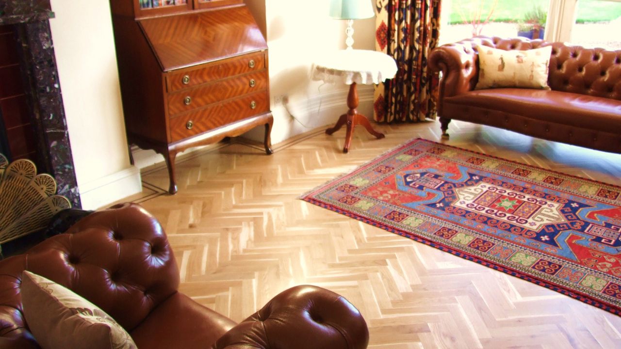 Oak herringbone wood floor with two stripe wenge border
