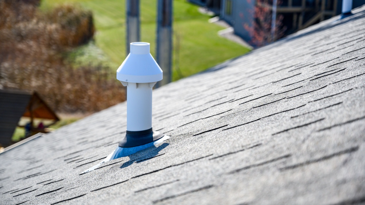 PVC chimney exhaust with boot on asphalt roof