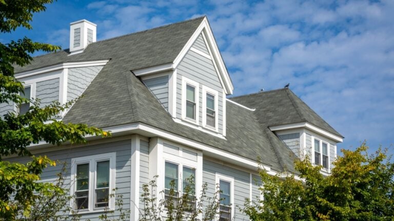 Newly built classic style family house with hipped and gabled dormers in the Brighton area of Boston, Massachusetts, USA