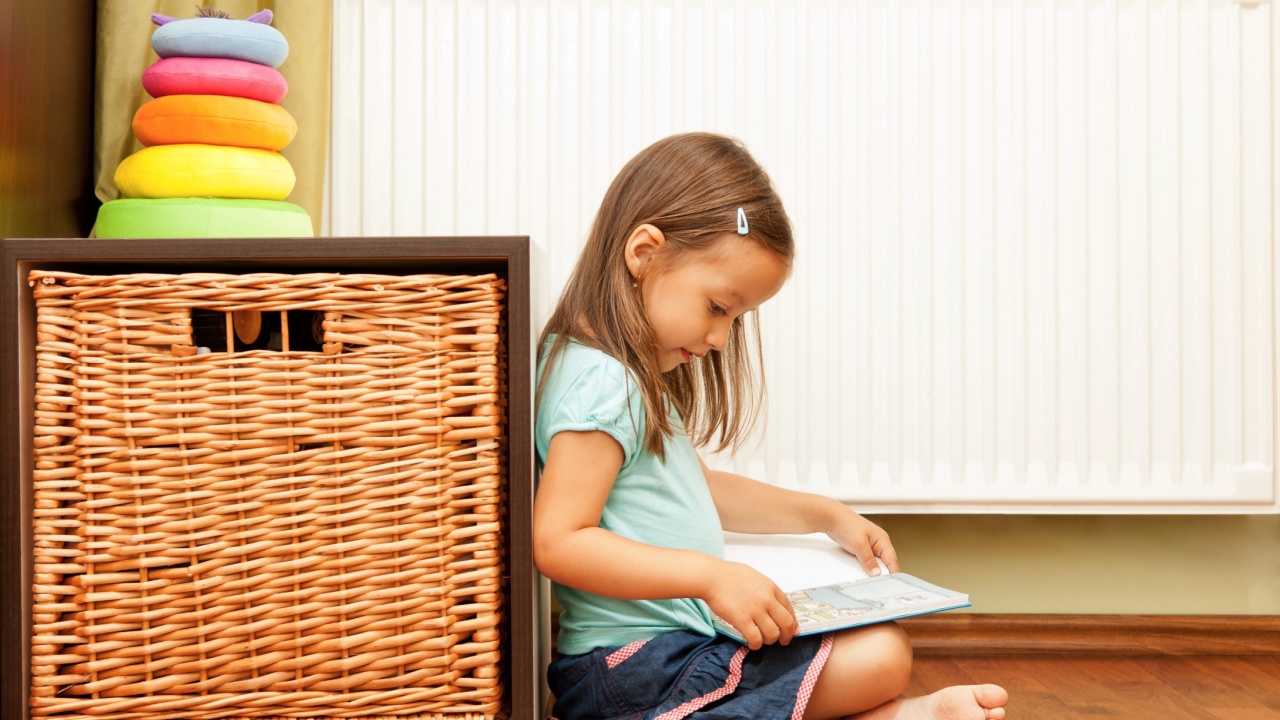 little girl reading a book