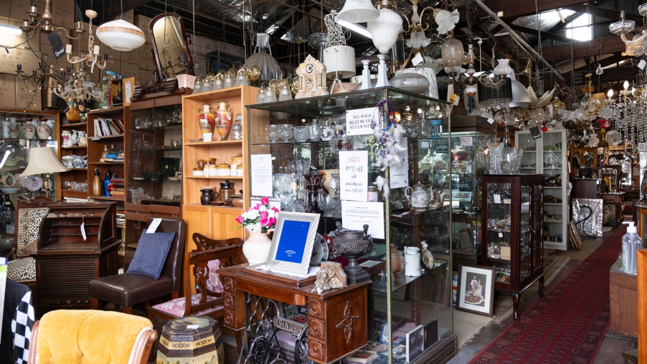MELBOURNE, VICTORIA, AUSTRALIA - MARCH 03 2024: Interior of a thrift store with antiques, brocante, glassware and all kinds of other objects and furniture