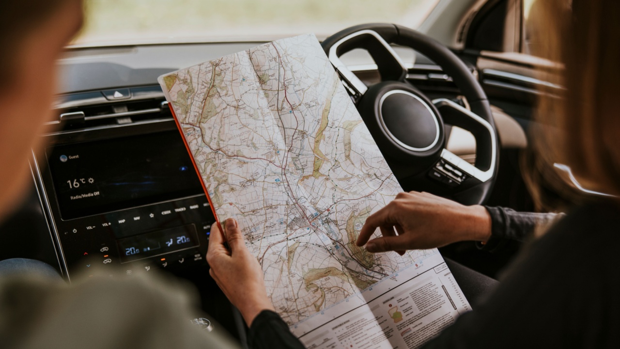 Driver looking at map in car photo