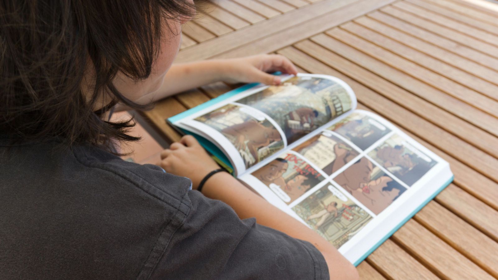 Boy reading comic book