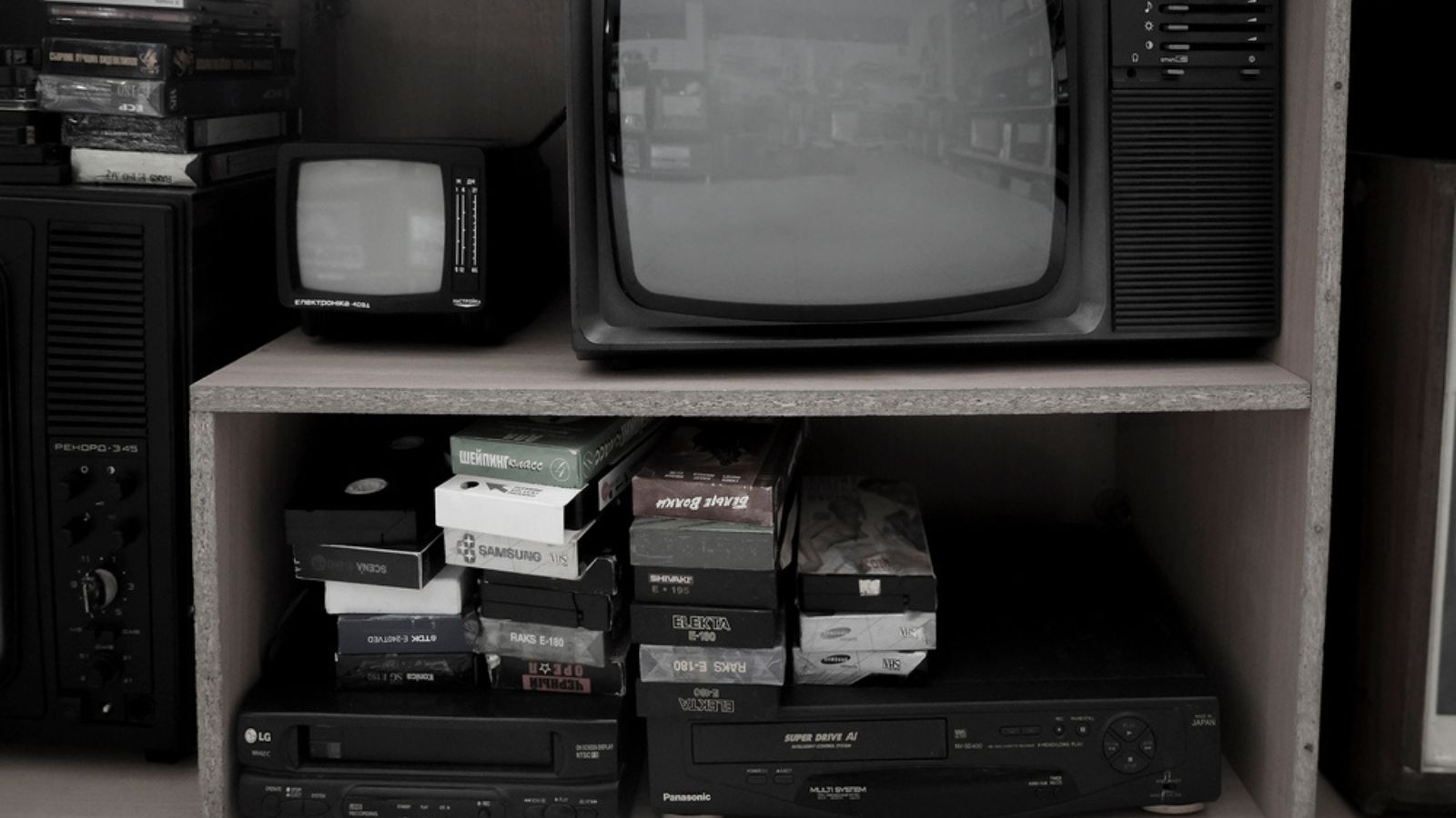 Old video recorder and tv. Vintage Video VHS Player on the shelf