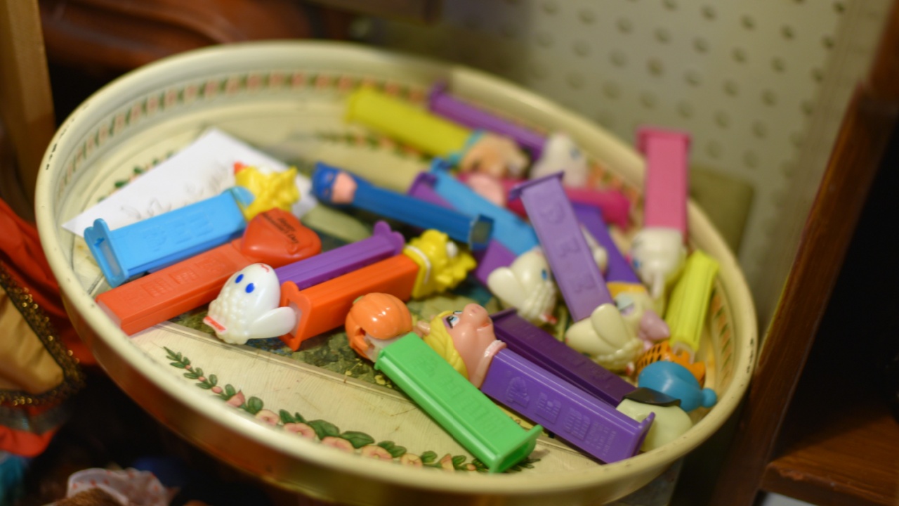 Mullica Hill, NJ/USA-January 5, 2019: collection of Pez candy dispensers with iconic characters as displayed in an antique store. Miss Piggy and Lambie Pie characters.