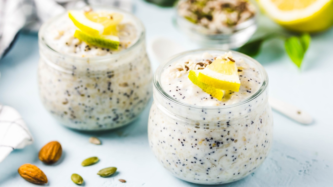 Lemon poppy seed overnight oats in glass jars. Selective focus, space for text.
