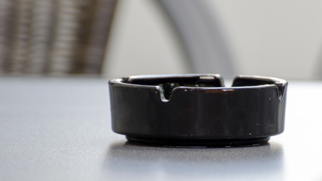 Detail of an empty black ceramic ashtray