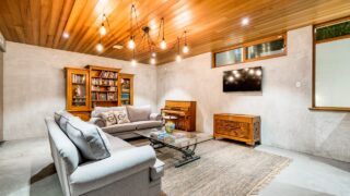 Basement with timber clad ceiling and couches in million dollar plus Australian home. PERTH, WESTERN AUSTRALIA. Photographed: September, 2018.