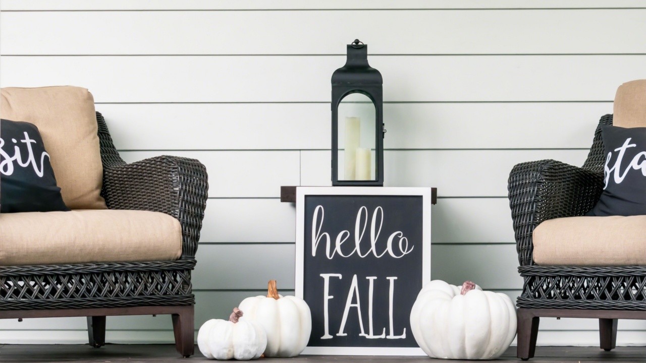 Stylish fall decorations in black and white on the front porch - hello fall