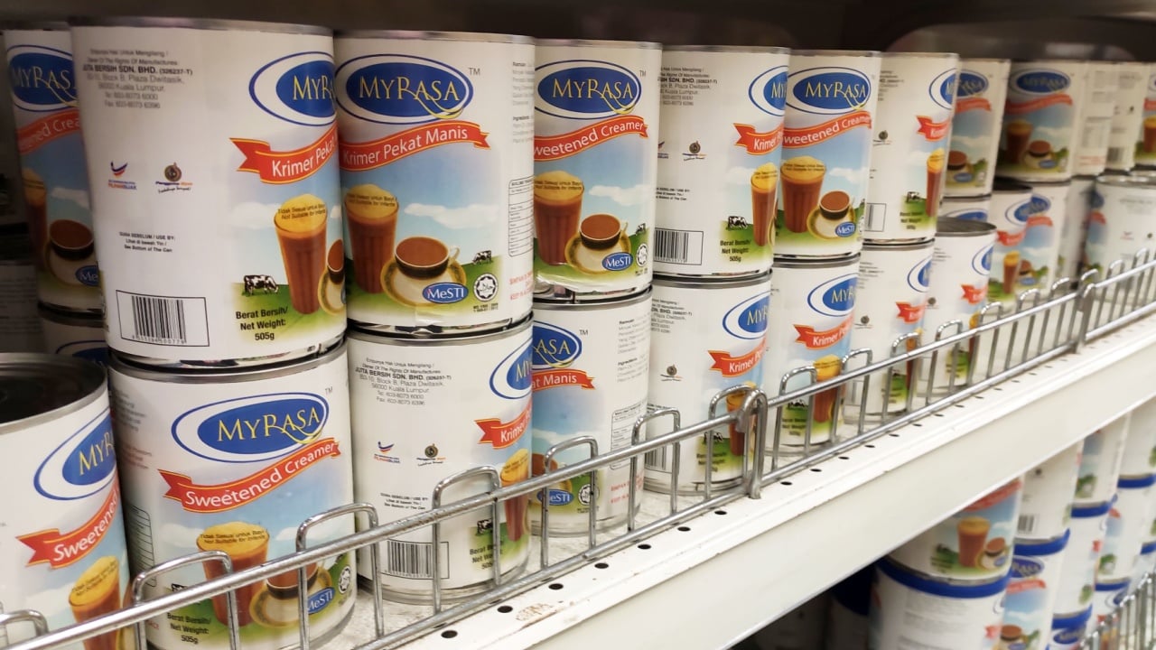 KUALA LUMPUR, MALAYSIA -DECEMBER 22, 2019: Sweetened creamer and evaporated milk packed in cans and displayed for sale on the rack inside the supermarket. The main ingredient is made from palm oil see