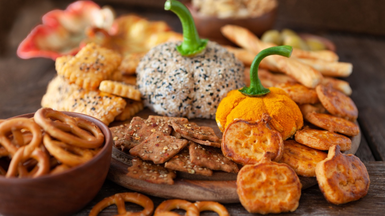 Cheese platter with cream cheese, crackers and nuts