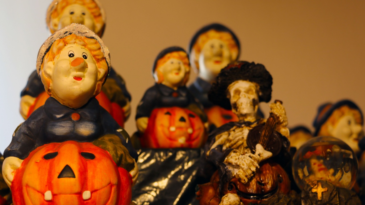 Preparation for the holiday. Halloween decoration. Scary figurines on the shelf
