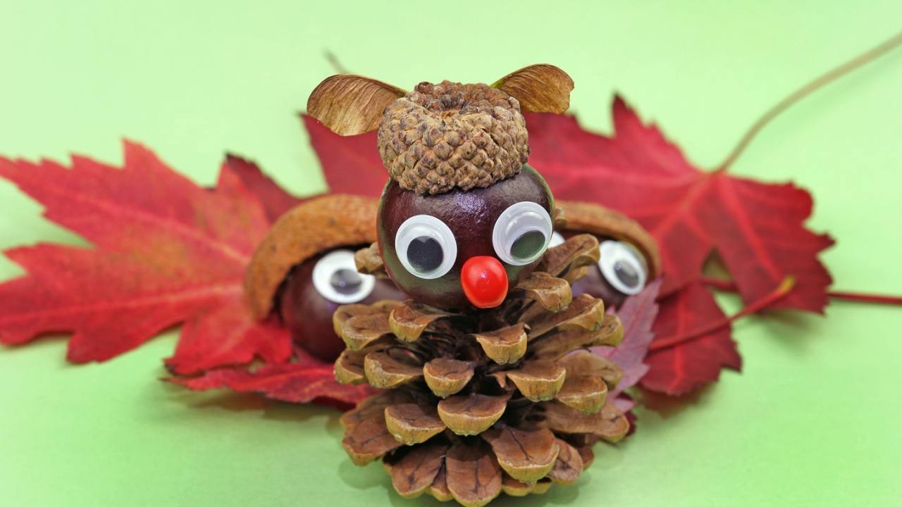 funny owl from pine cone and acorn hat tinker with children in autumn