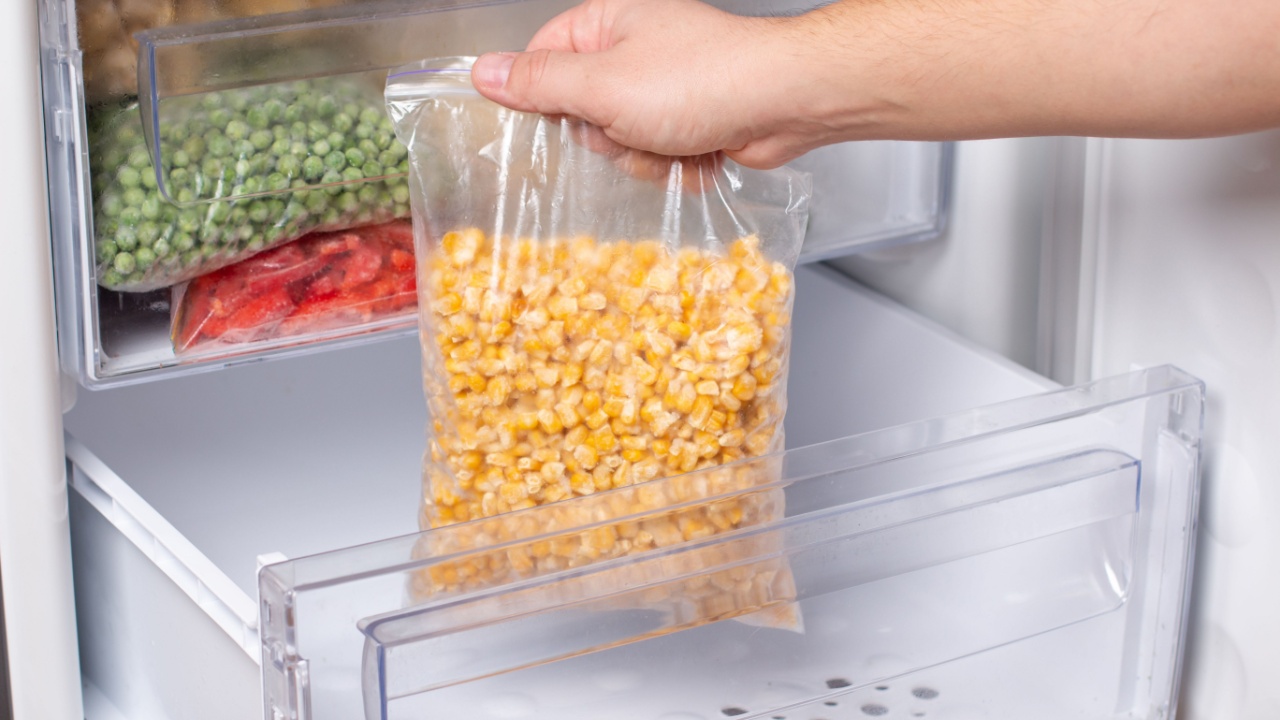 Frozen corn in bag in freezer, close up. Frozen food