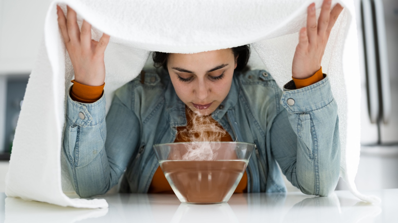 Woman Doing Inhalation Alternative Herbal Medicine Using Steam Bowl