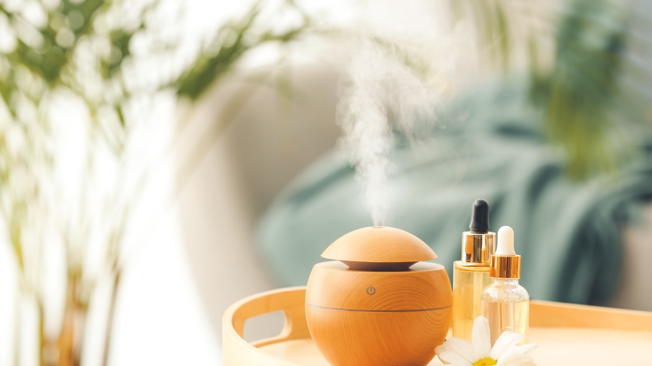 Aroma oil diffuser on table in room