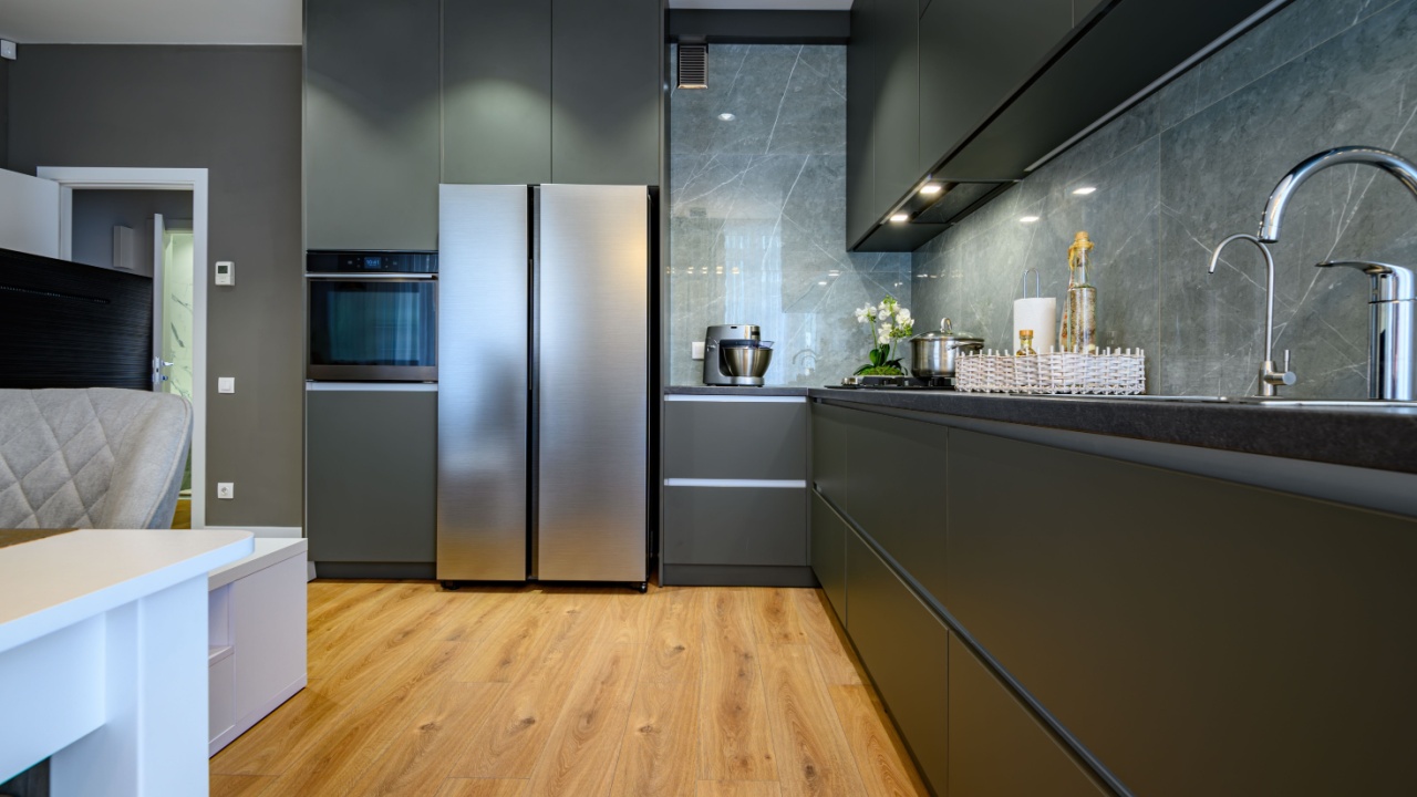 Modern trendy luxury dark gray kitchen closeup