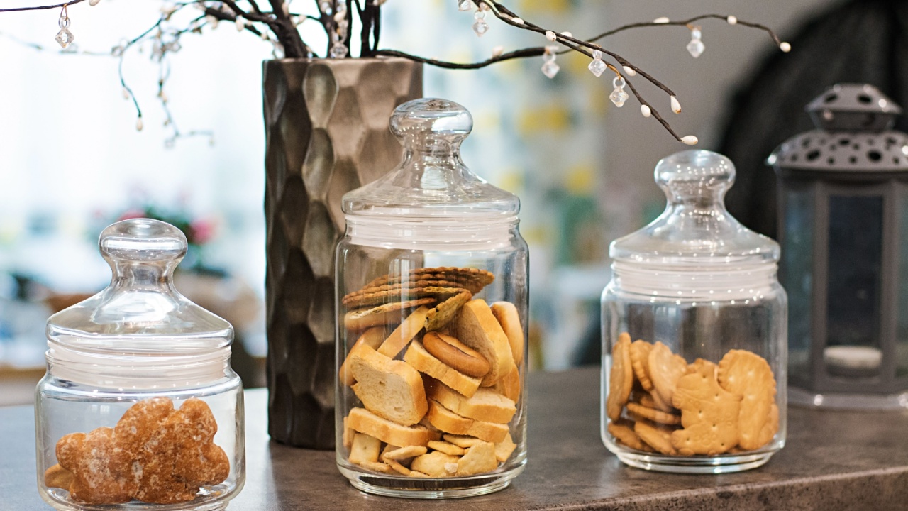 Glass jars with various cookies and crackers.