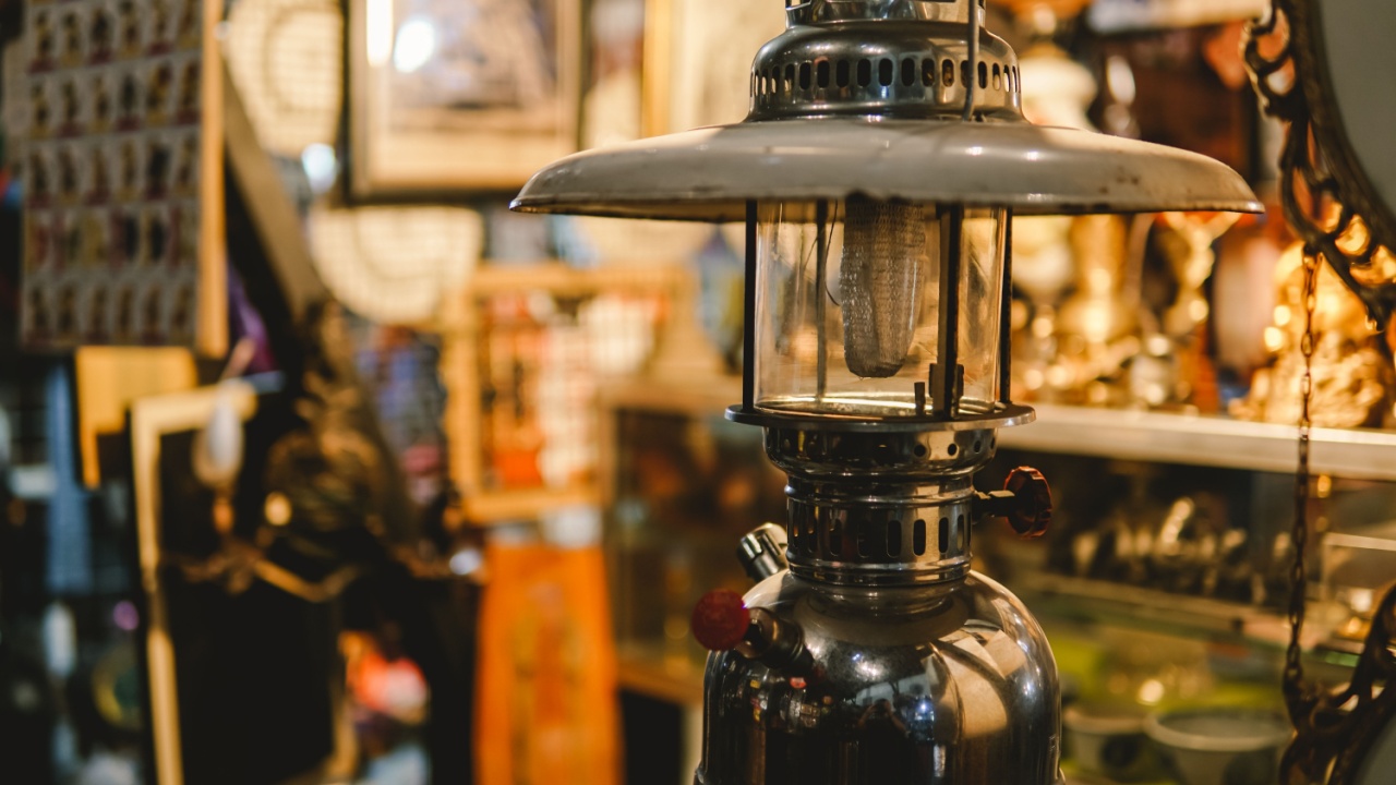 antiques in the vintage shop: art, toy cars, lantern lamps, sculpture, miniatures, old cameras, televisions, typewriter, etc. Kota Lama Semarang (Old Town), Indonesia antique store.