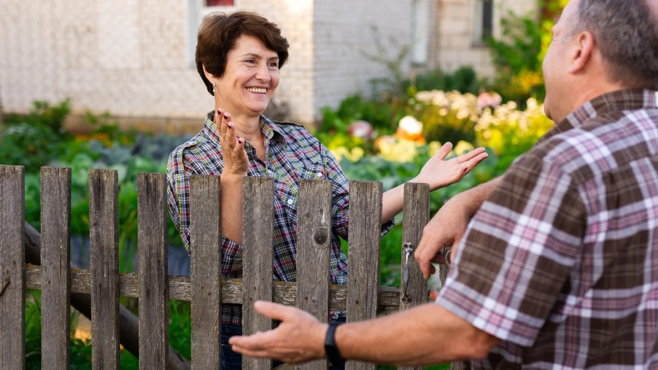 neighbors man and woman chatting near the