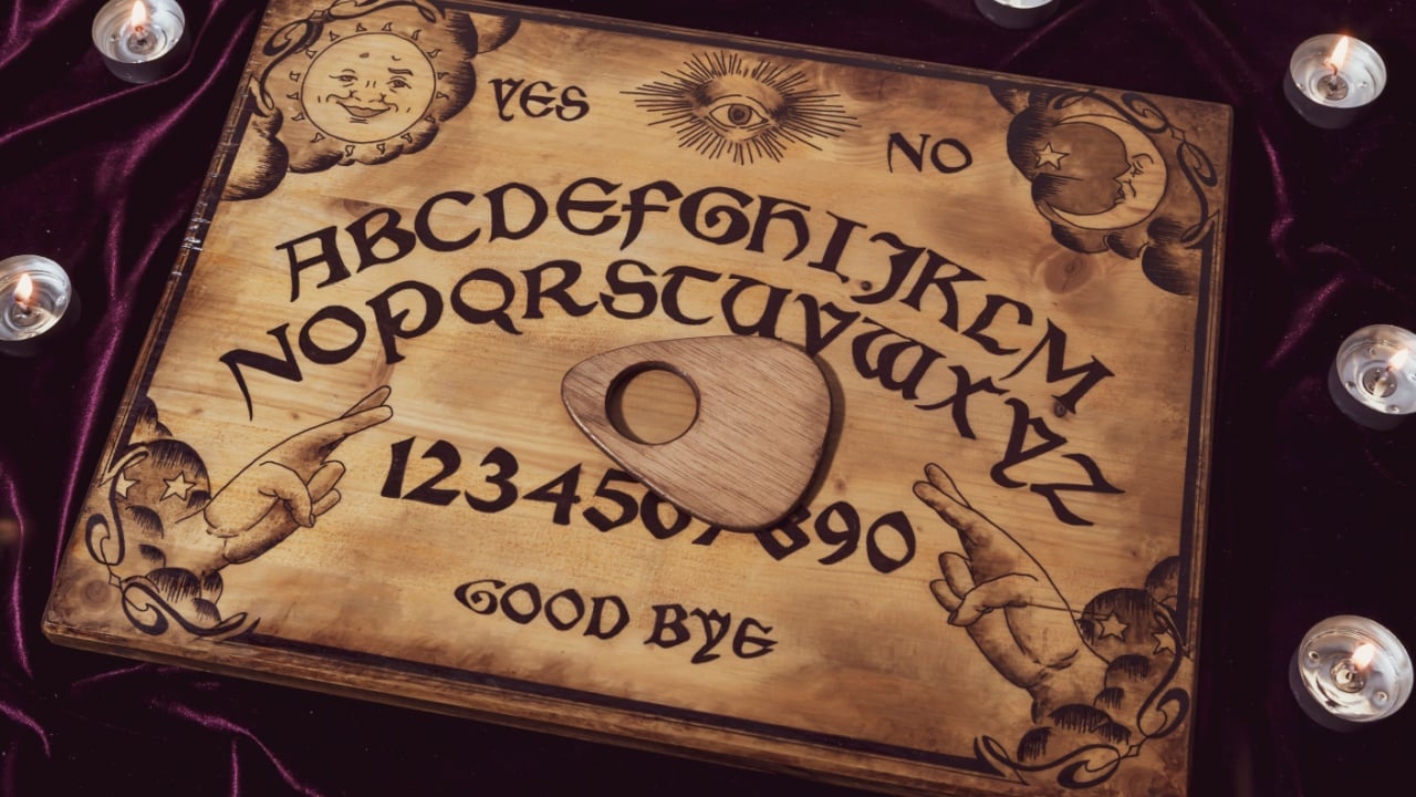 Handmade ouija board with candles