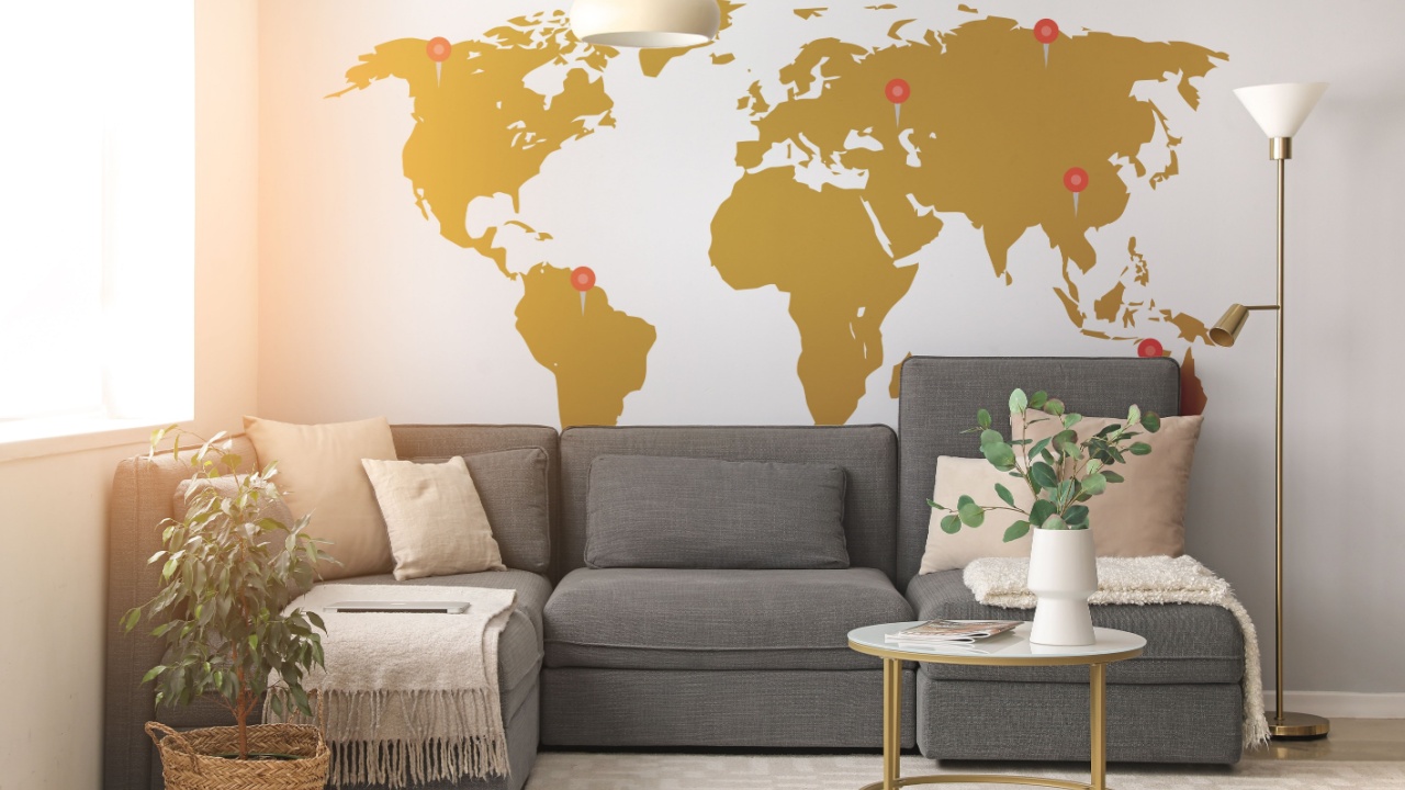 Interior of modern living room with cozy sofa and printed world map on wall
