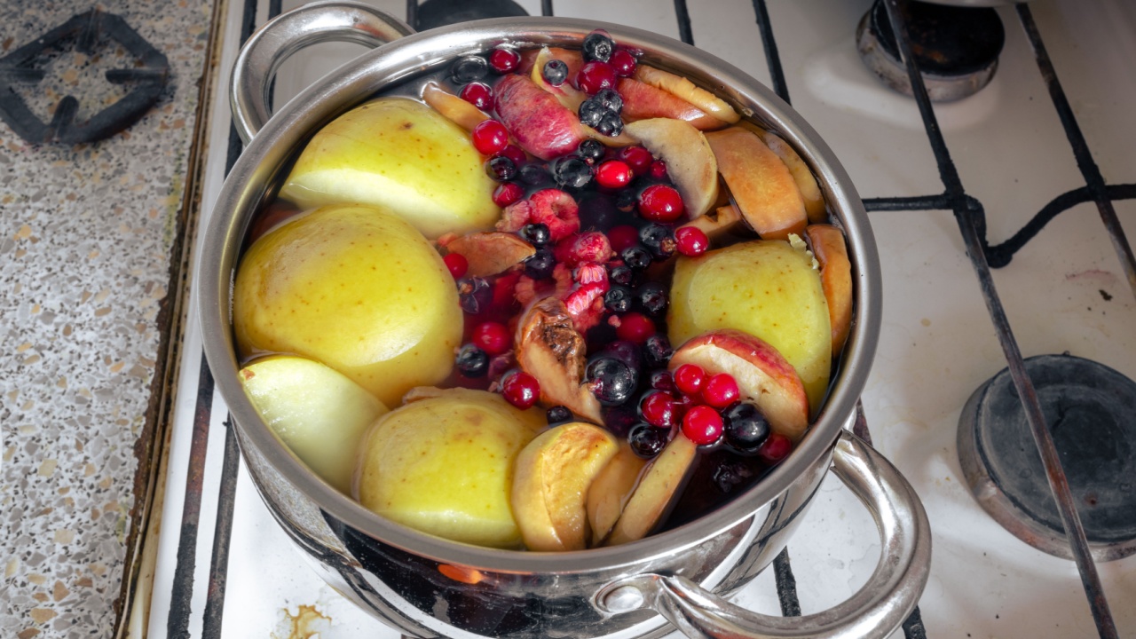 Delicious compost of fruits and berries. Fresh boiled fruit compote in a saucepan