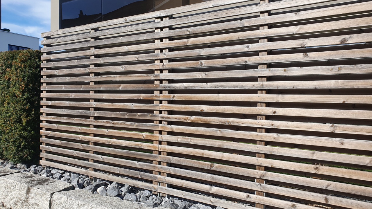 Horizontal slats on the fence, fence of wooden planks.