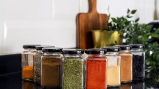 Various dried spices in glass jars